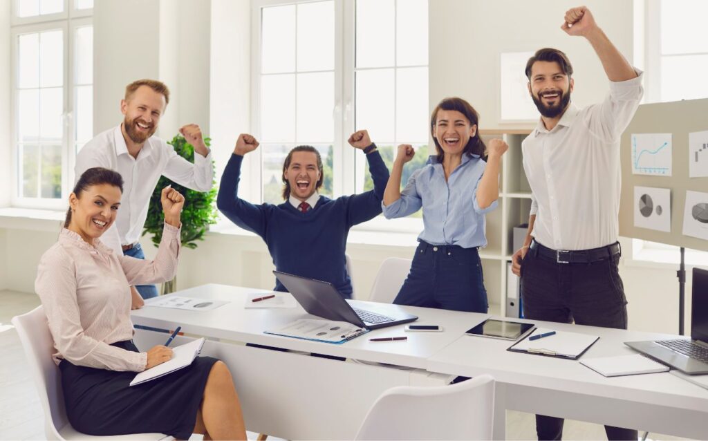 coworkers happy together at work because of the execellent social skills